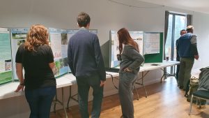 People looking at posters at an event